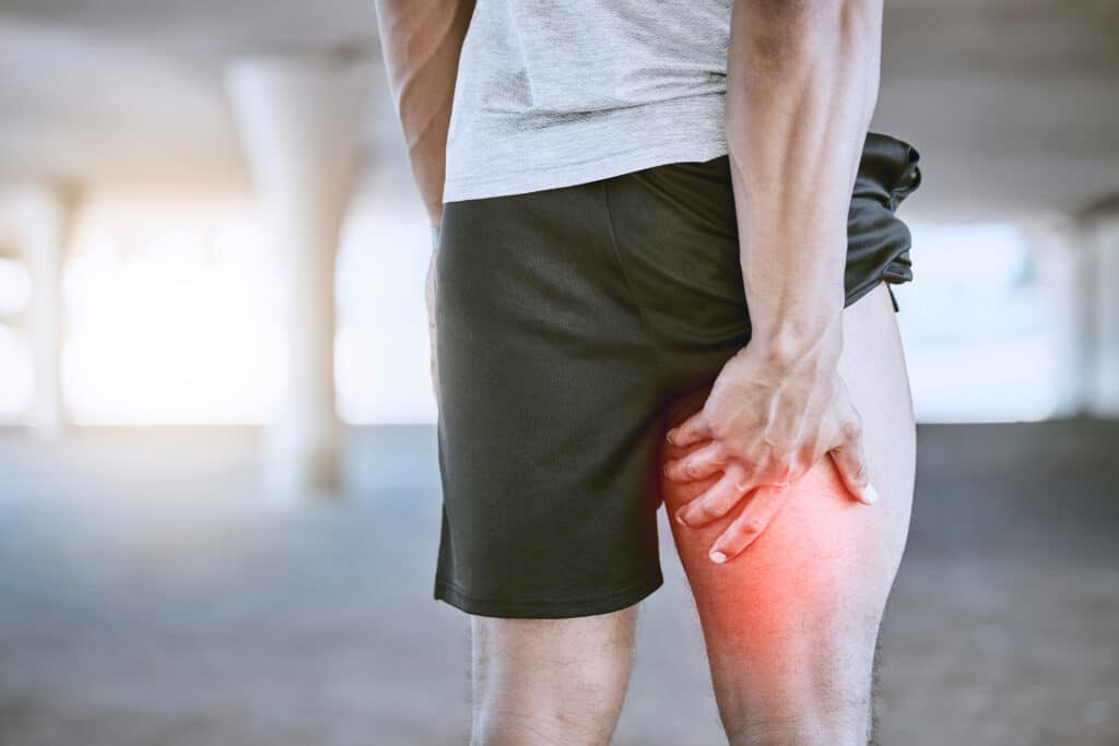 Sports man, runner and thigh injury to hamstring muscle for fitness, wellness and health person. Running, workout and exercise expert suffer medical leg pain after high performance training in city.